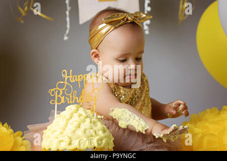 Smiling baby girl celebrating her first birthday Stock Photo