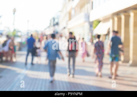 Motion blured people. Slow shutter speed. Bussie people on the street. Stock Photo