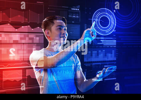 Very Positive Developer Positive web developer smiling and touching the transparent screen ...