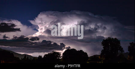 Panorama view of dramatic lightning storm illuminates nighttime sky; Salida; Colorado; USA Stock Photo