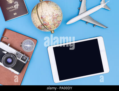 Blank tablet screen mock up with retro  travel objects Stock Photo