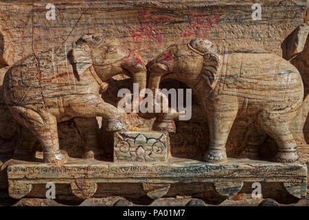 Carved elephants on the wall of a temple, Udaipur, Rajasthan, India Stock Photo