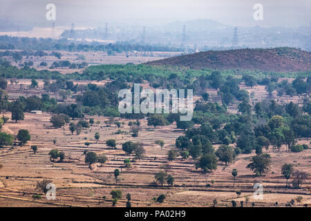 aerial photo of agro landscape of field & small forest  from a top of mountain hills  summer view of green land with fields and gardens. Stock Photo