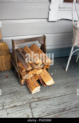 small stack of firewood in a wooden holder, Finland Stock Photo