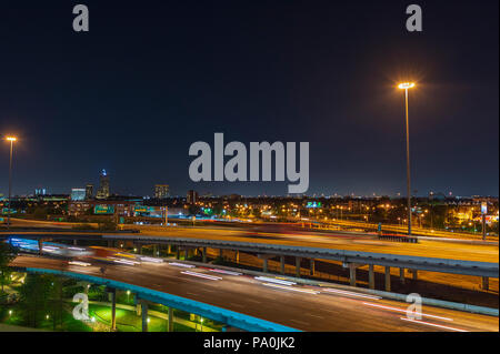 Streaking car lights at night on Interstate 45 through downtown Houston Stock Photo