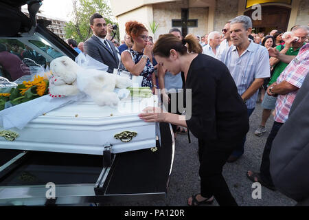 Rossano, Italy. 19th July, 2018. Rossano, the funeral of Stanislao Acri, a 35-year-old lawyer, his wife Daria Stella Olivo, aged 35, and their little 6-month-old Pier Antonio Acri, who died on 15 July in a terrible accident on the A1 near Frosinone. They were coming back from Rome on board their Fiat Punto and were hit by a van. Stanislao Acri had been nominated for mayor of Rossano for the Movimento 5 Stelle.19/07/2018, Rossano, Italy Credit: Independent Photo Agency Srl/Alamy Live News Stock Photo