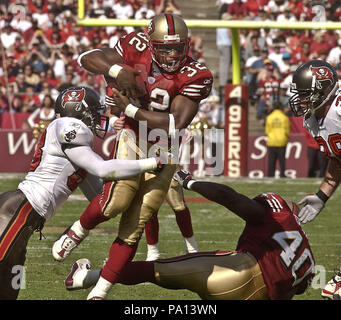 Tampa Bay Buccaneers' linebacker Shelton Quarles (53) tackles Seattle  Seahawks' running back Shaun Alexander as Seahawks' tight end Jerramy  Stevens (86) blocks Buccaneers' defensive end Greg Spires (94) at Raymond  James Stadium