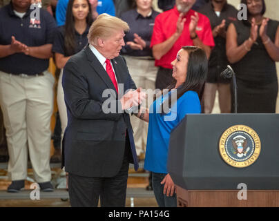 Washington DC, USA. 19th July, 2018. United States President Donald J. Trump, left, and Brianna DeAngelo, Apprentice 1st year, Associated Builders and Contractors, right, prior to his signing an Executive Order establishing the National Council for the American Worker, which the Trump Administration calls 'an Interagency Council of Administration officials who will focus on crafting solutions to our country's urgent workforce issues' in the East Room of the White House in Washington, DC on Thursday, July 19, 2018. Credit: MediaPunch Inc/Alamy Live News Stock Photo