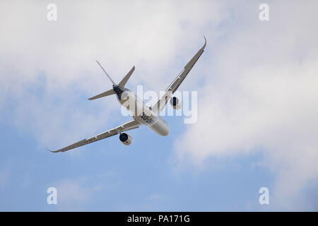 Farnborough, Hampshire, UK. 19th July, 2018. An Airbus A350-1000 flying during a display on day four of the Farnborough International Airshow (FIA) which is taking place in Farnborough, Hampshire, UK.  The air show, a biannual showcase for the aviation industry, is the biggest of it's kind and attracts civil and military buyers from all over the world. trade visitors are normally in excess of 100,000 people. The trade side of the show runs until July 20 and is followed by a weekend of air displays aimed at the general public.   Credit: Michael Preston/Alamy Live News Stock Photo