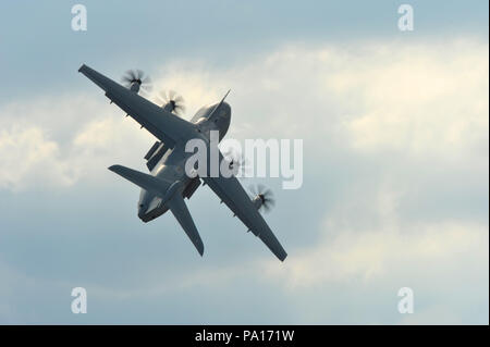 Farnborough, Hampshire, UK. 19th July, 2018. An Airbus A400-M flying during a display on day four of the Farnborough International Airshow (FIA) which is taking place in Farnborough, Hampshire, UK.  The air show, a biannual showcase for the aviation industry, is the biggest of it's kind and attracts civil and military buyers from all over the world. trade visitors are normally in excess of 100,000 people. The trade side of the show runs until July 20 and is followed by a weekend of air displays aimed at the general public.   Credit: Michael Preston/Alamy Live News Stock Photo