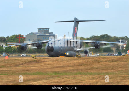 Farnborough, Hampshire, UK. 19th July, 2018. An Airbus A400-M taking off during a display on day four of the Farnborough International Airshow (FIA) which is taking place in Farnborough, Hampshire, UK.  The air show, a biannual showcase for the aviation industry, is the biggest of it's kind and attracts civil and military buyers from all over the world. trade visitors are normally in excess of 100,000 people. The trade side of the show runs until July 20 and is followed by a weekend of air displays aimed at the general public.   Credit: Michael Preston/Alamy Live News Stock Photo