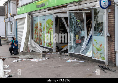 Brentwood, Essex 20th July 2018 an ATM machine was stolen from the wall of a Co-Op Store in Brentwood.  Essex Police were contacted by several members of the public at around 1.20am today, Friday July 20, after thieves targeted the store in Rayleigh Road, Hutton.  The suspects, who were wearing dark clothing and balaclavas, used a Land Rover to crash into the front of the store before then using an angle grinder to remove the cash machine from the damaged wall.     Credit: Ian Davidson/Alamy Live News Stock Photo