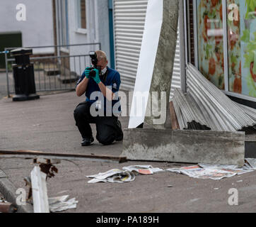 Brentwood, Essex 20th July 2018 an ATM machine was stolen from the wall of a Co-Op Store in Brentwood.  Essex Police were contacted by several members of the public at around 1.20am today, Friday July 20, after thieves targeted the store in Rayleigh Road, Hutton.  The suspects, who were wearing dark clothing and balaclavas, used a Land Rover to crash into the front of the store before then using an angle grinder to remove the cash machine from the damaged wall.     Credit: Ian Davidson/Alamy Live News Stock Photo