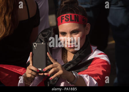 Managua, Nicaragua. 19th July, 2018. A supporter of the Sandinista National Liberation Front (FSLN) taking part in an event in conmemoration of the 39th anniversary of the Sandinista revolution. The Nicaraguan president has accused the country's Catholic church of being part of an attempted coup against his government. According to Ortega, the country's Catholic bishops aren't intermediaries in the political crisis, but rather part of a putschist conspiracy. Credit: Carlos Herrera/dpa/Alamy Live News Stock Photo