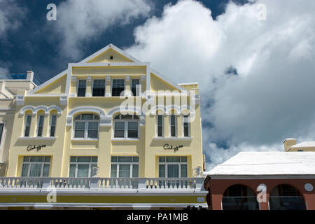 A colorful British colonial style building houses shops along Front Street in Hamilton, the capital of Bermuda. Stock Photo