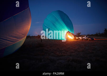 19th July 2018, two hot air balloons attempting a long distance flight, launch from a field near Merbein in North West Victoria, Australia. Stock Photo