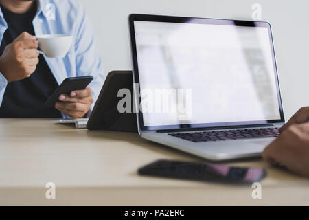 Laptop with blank screen on table. Workspace background new project on laptop computer with blank copy space screen for your advertising text message Stock Photo