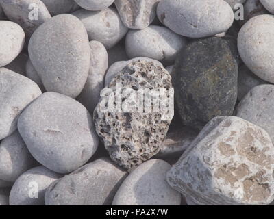 Grey pebbles on the beach, close up Stock Photo