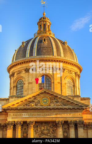 Details of central dome roof of Institut de France building, a French learned society group of five academies in Paris, France, Europe. Sunny day in the blue sky. Vertical shot. Stock Photo