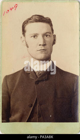 . Mug shot of Eddie Guerin, head-and-shoulders portrait, marked '1049'. Eddie Guerin, 80, Irish-born international crook, bank robber and purse-snatcher; [died] in poverty, at Bury, Lancashire, England. Celebrated for his criminal exploits in collaboration with the legendary 'Chicago May' Churchill, who helped him stick up the American Express office in Paris, Guerin made a sensational escape from Devil's Island in 1905, only to find, when he reached London, that 'Chicago May' had deserted him for a new lover. — TIME, 16 December 1940. circa 1900 605 Eddie Guerin, mug shot, ca. 1900 Stock Photo