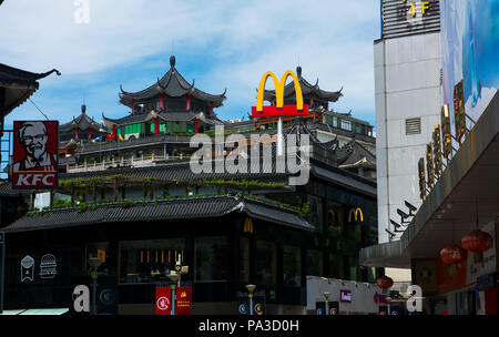 Shenzhen, China - July 16, 2018: McDonalds and KFC in China, Dong Men Pedestrian street in the old Shenzhen in traditional shaped building Stock Photo