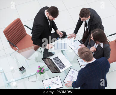 successful business team discussing marketing graphics before the meeting Stock Photo