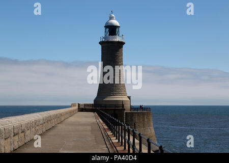 Tynemouth Lighthouse at Tynemouth in England. The lighthouse stands on the North Pier that was designed by John Wolfe-Barry and reconstructed in 1909. Stock Photo