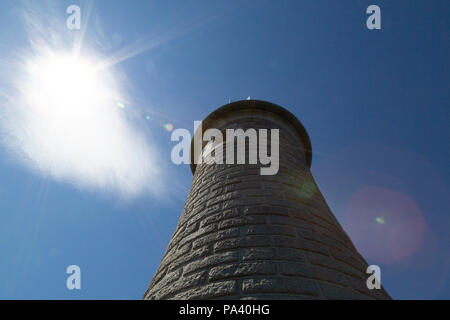 Lens falre caused by sunshine above Tynemouth Lighthouse at Tynemouth in England. The lighthouse stands on the North Pier that was designed by John Wo Stock Photo