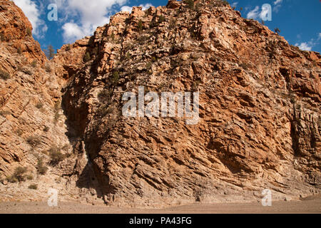 Brachina Gorge South Australia, dry riverbed with red hills of vertically layered rock Stock Photo