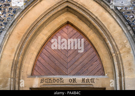 Arch above the doorway with carved inscription in the stonework for the former Winchester School of Art, Hampshire, England. Stock Photo