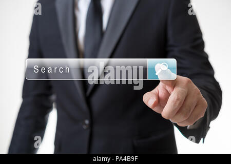 Man is clicking search button on virtual screen Stock Photo