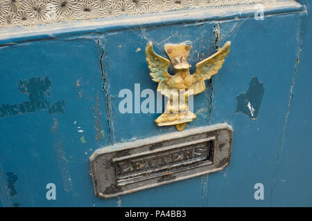 A letterbox on a door in the village of Lacock in Wiltshire, England. Stock Photo