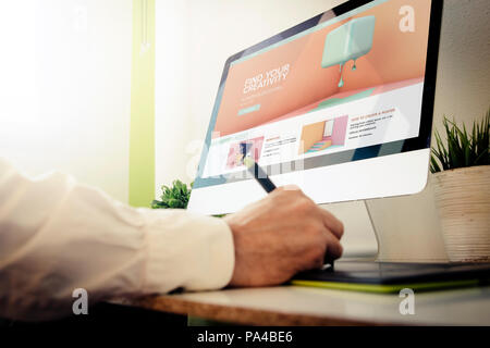 designer learning with tutorials. All screen graphics are made up. Stock Photo