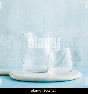 empty glass decanter and drink glass on the table Stock Photo