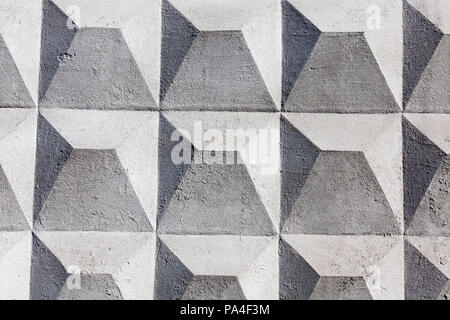concrete fence in the form of pyramids, painted in white, a close-up of the details of the structure Stock Photo