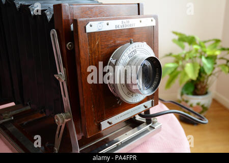 A foldable large format Deardorff antique 8x10 analog field camera and Kodak lens built in the 1950s. Stock Photo