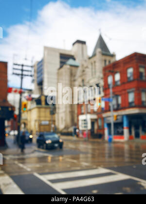 Blurred blurry soft focus background, busy downtown street with cars and lights, urban city life concept, old historical and modern buildings Stock Photo