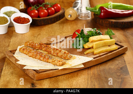 Chicken Adana kebap served with lavash Stock Photo