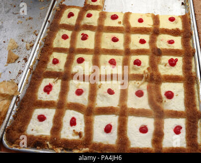 Arabic dessert made with custard, coconut and strawberry also known as The Queen's Honey Stock Photo