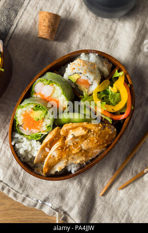 Homemade Sushi Bento Box with Rice and Chicken for Lunch Stock Photo