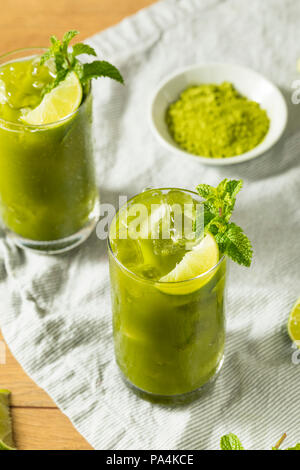 Raw Green Organic Matcha Iced Tea Detox with Lime and Mint Stock Photo