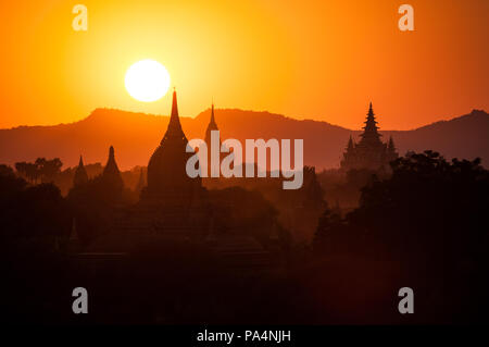 Pagoda silhouettes during a sunset in Bagan, Myanmar (Burma) Stock Photo