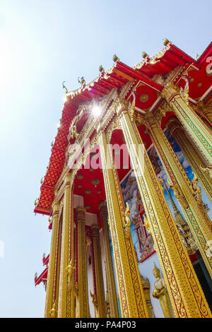 Close up beautiful temple roof with blue sky in Thailand Stock Photo