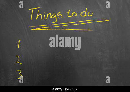 Things to do list chalk text on blackboard or chalkboard as management priorities schedule task concept with empty copy space Stock Photo