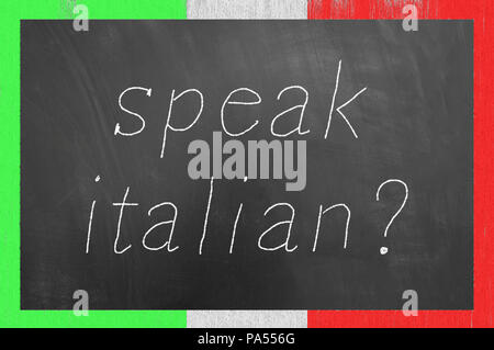 Speak Italian chalk text on flag frame blackboard or chalkboard as foreign language school university lesson concept Stock Photo