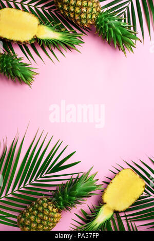 Pattern with bright pineapples on yellow background. Top View. Copy Space. Minimal style. Pop art design, creative summer concept Stock Photo