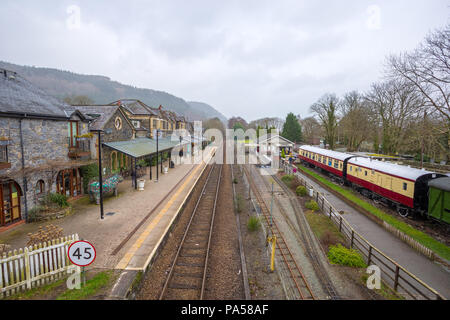 Betws-y-Coed train station, old fashioned station with carriages and track in to the distant Welsh Countryside Stock Photo