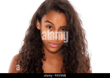 beautiful dark skinned girl with distrustful look Stock Photo