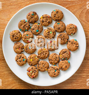 Lay flat photo of cookies on white plate. Stock Photo