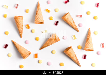 Ice crean cones and candy lay flat image wallpaper Stock Photo